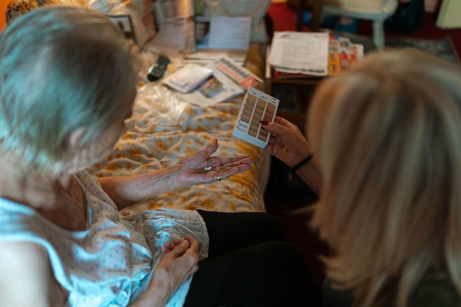 A caregiver visiting and supporting a client at home